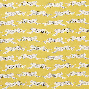 Schumacher Leaping Leopards fabric swatch in yellow
