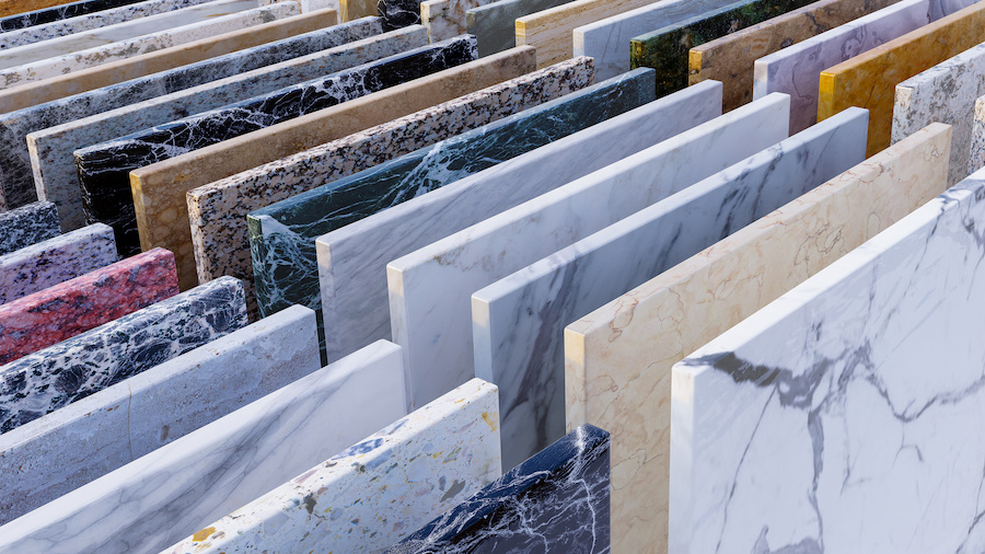 Modern kitchen backsplash of white marble slabs, floor tile, and granite color samples